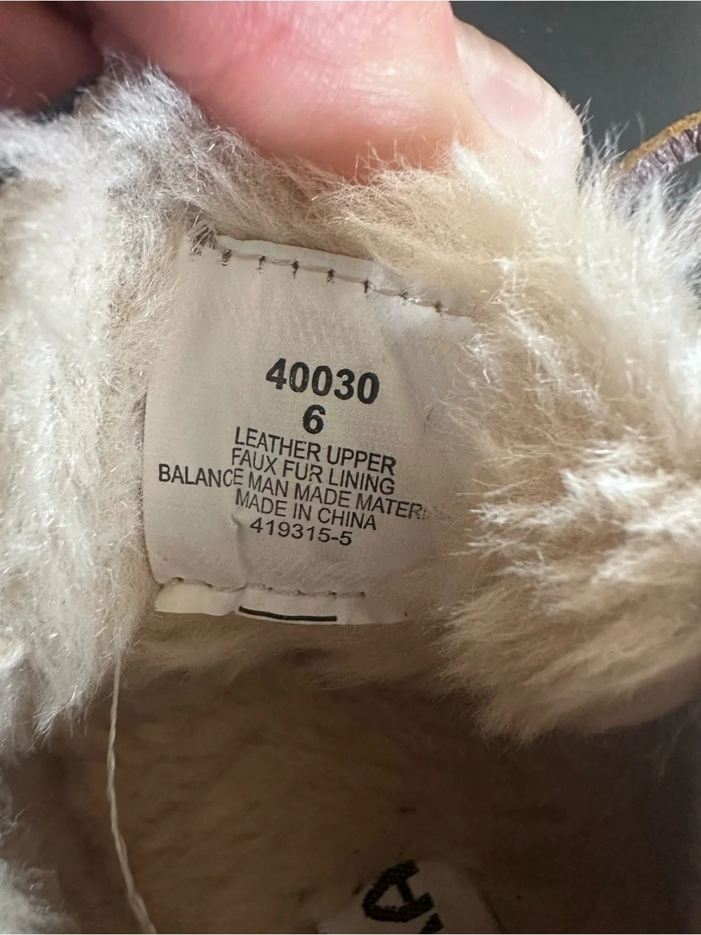 Minnetonka Black Moccasin Slippers with Cream Faux Fur Trim